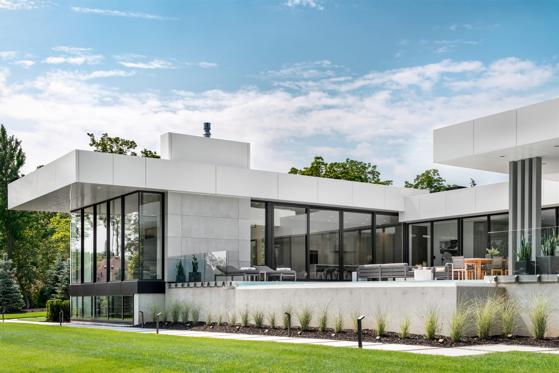Modern custom home in Grimsby, featuring a stunning resort inspired backyard retreat.
